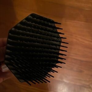 Black scalp scrubber exfoliate